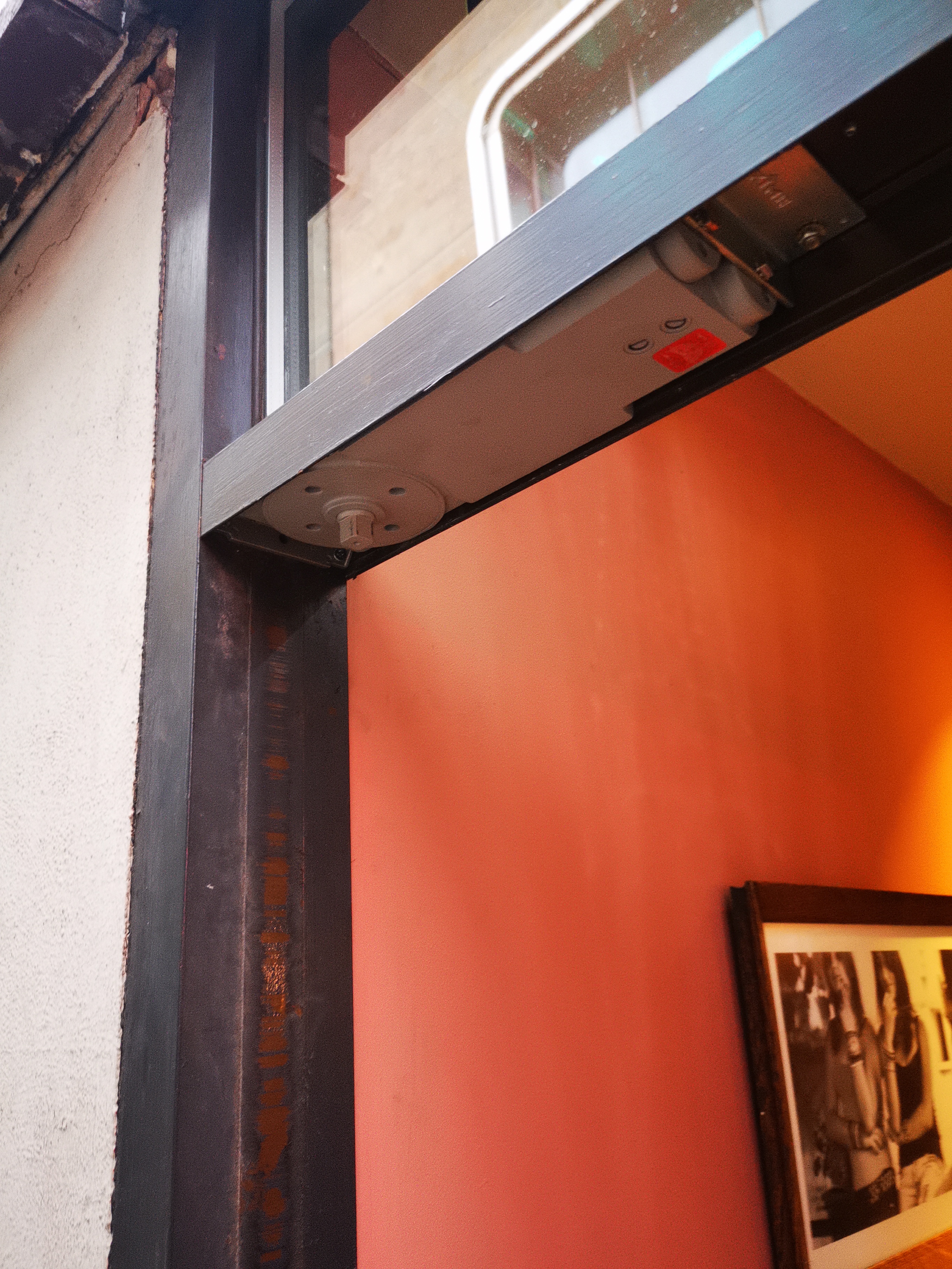 Axim concealed door closer fitted at Cafe Nero in Leeds city centre