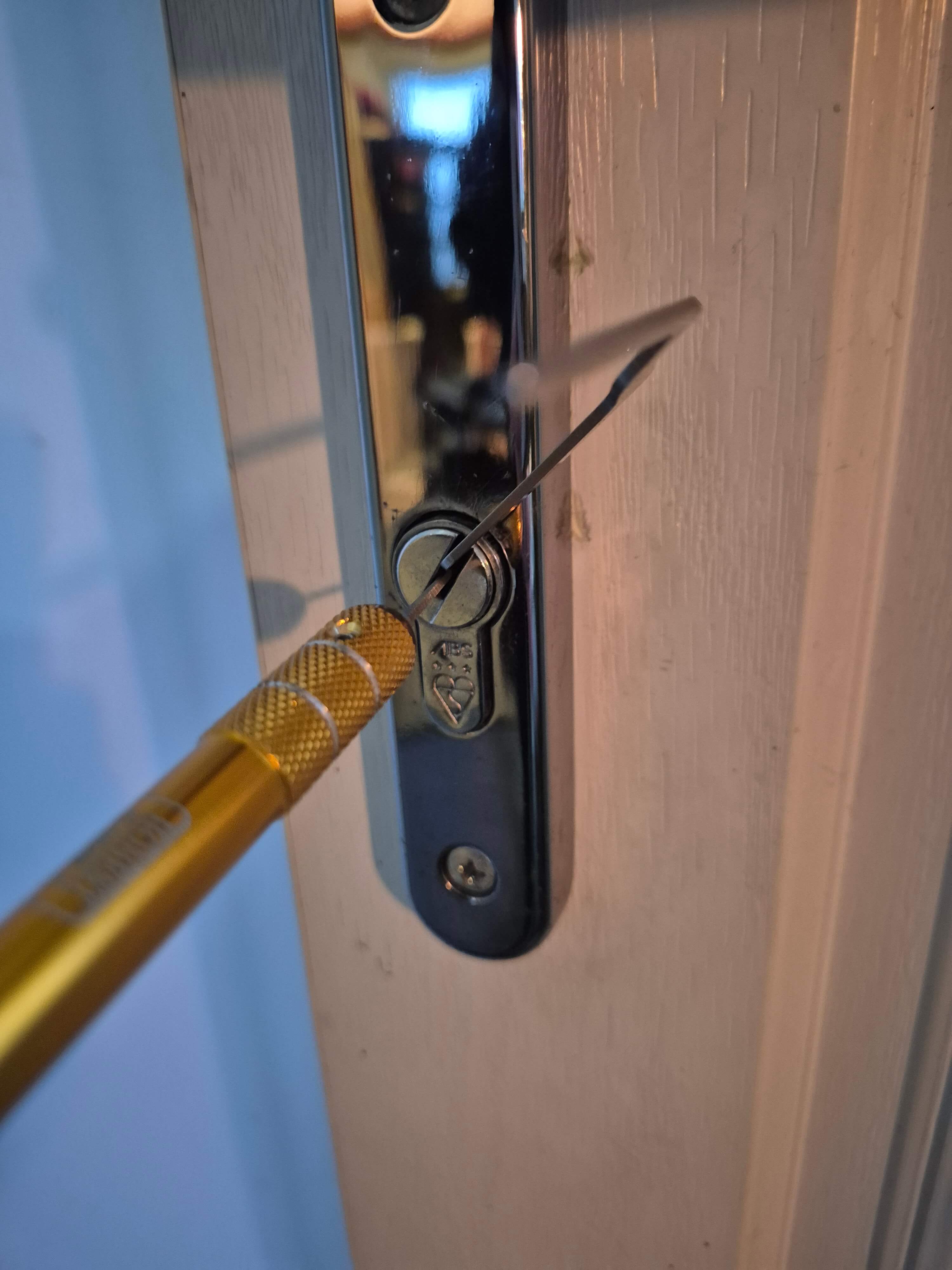 Avocet ABS Lock Picked open on white composite door with gold coloured lock pick