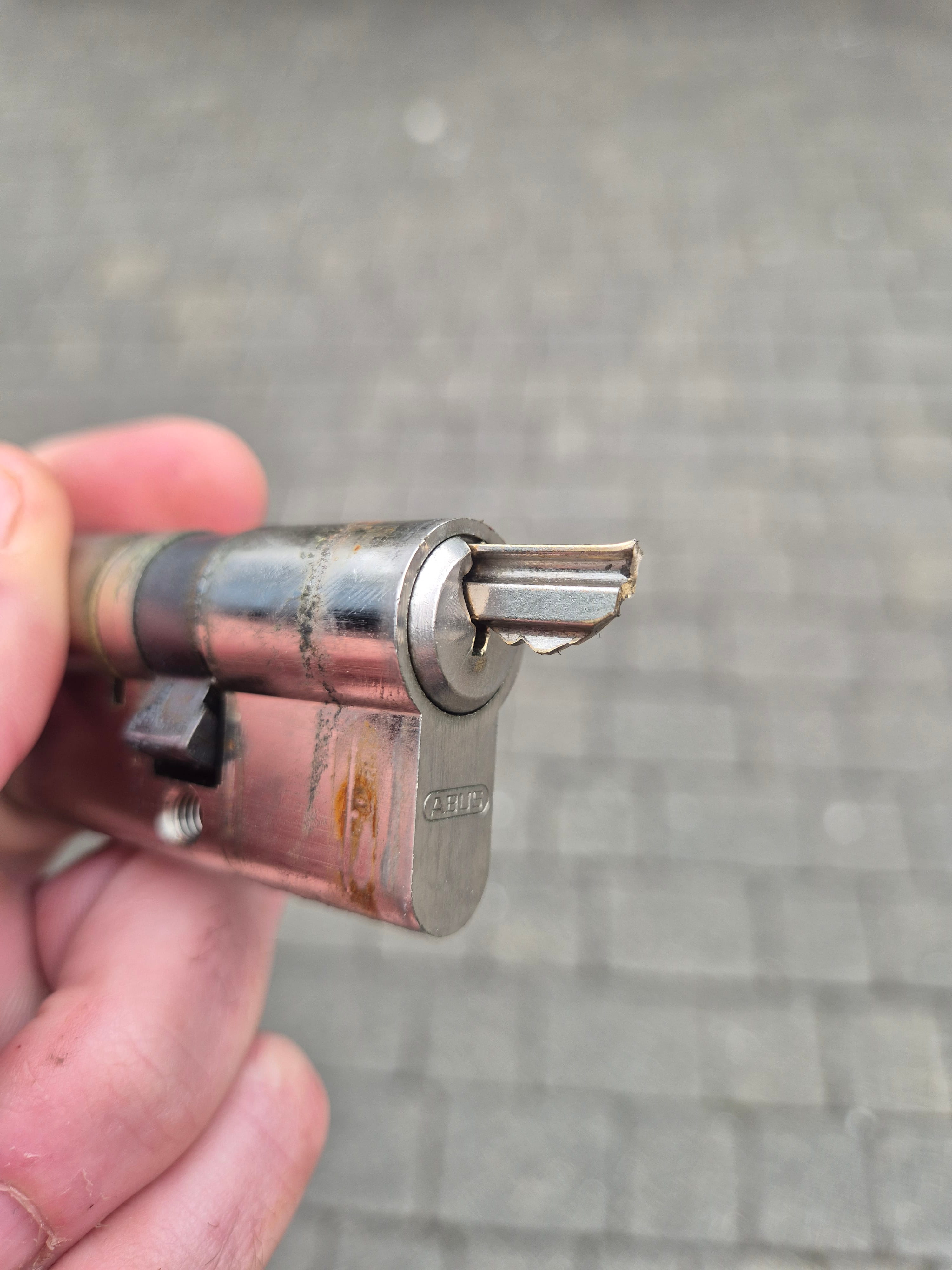 Broken key removed from chrome Abus euro cylinder in Cross Gates