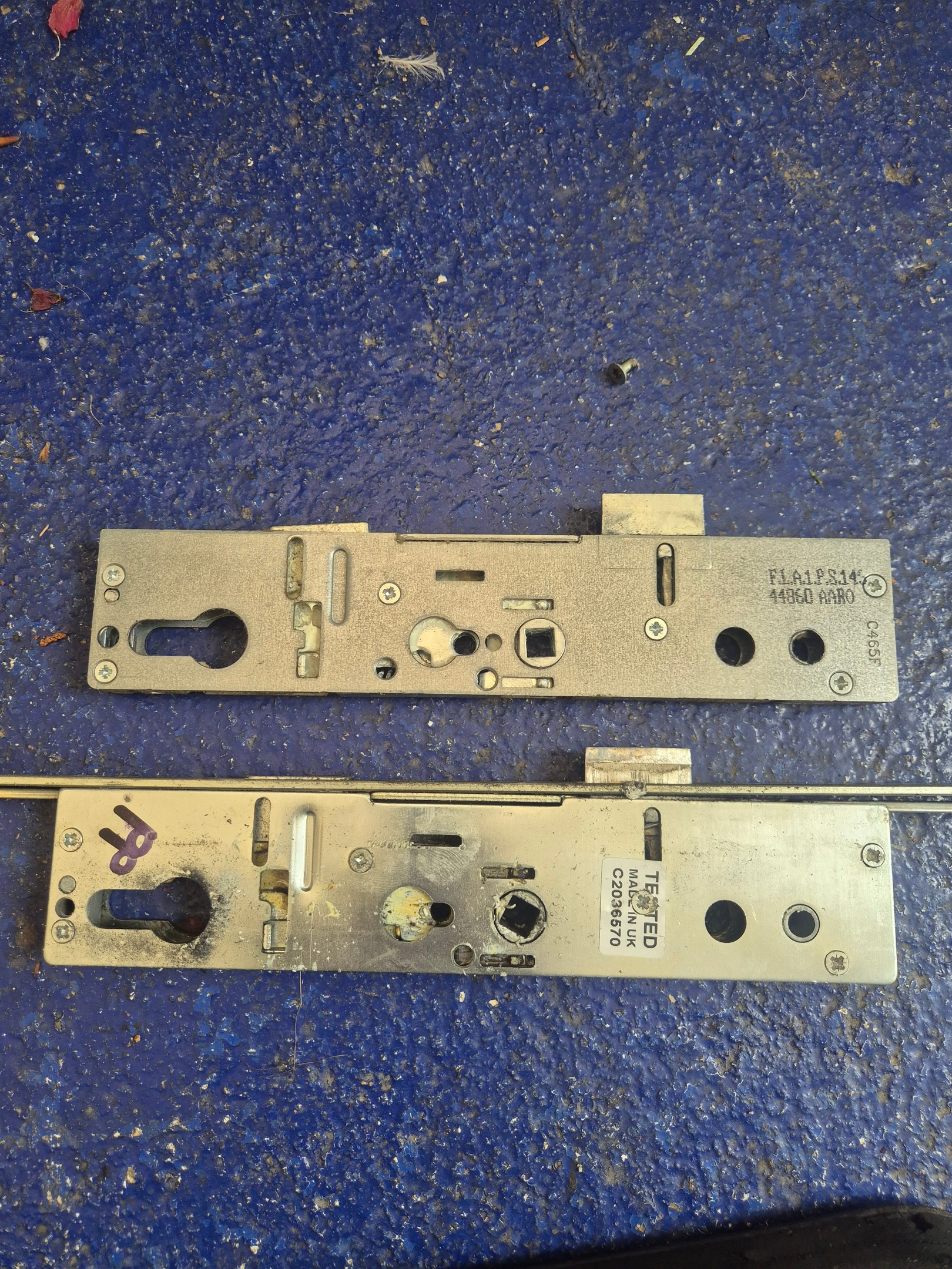 Lockmaster gearbox replacement during upvc door repair laid on blue floor