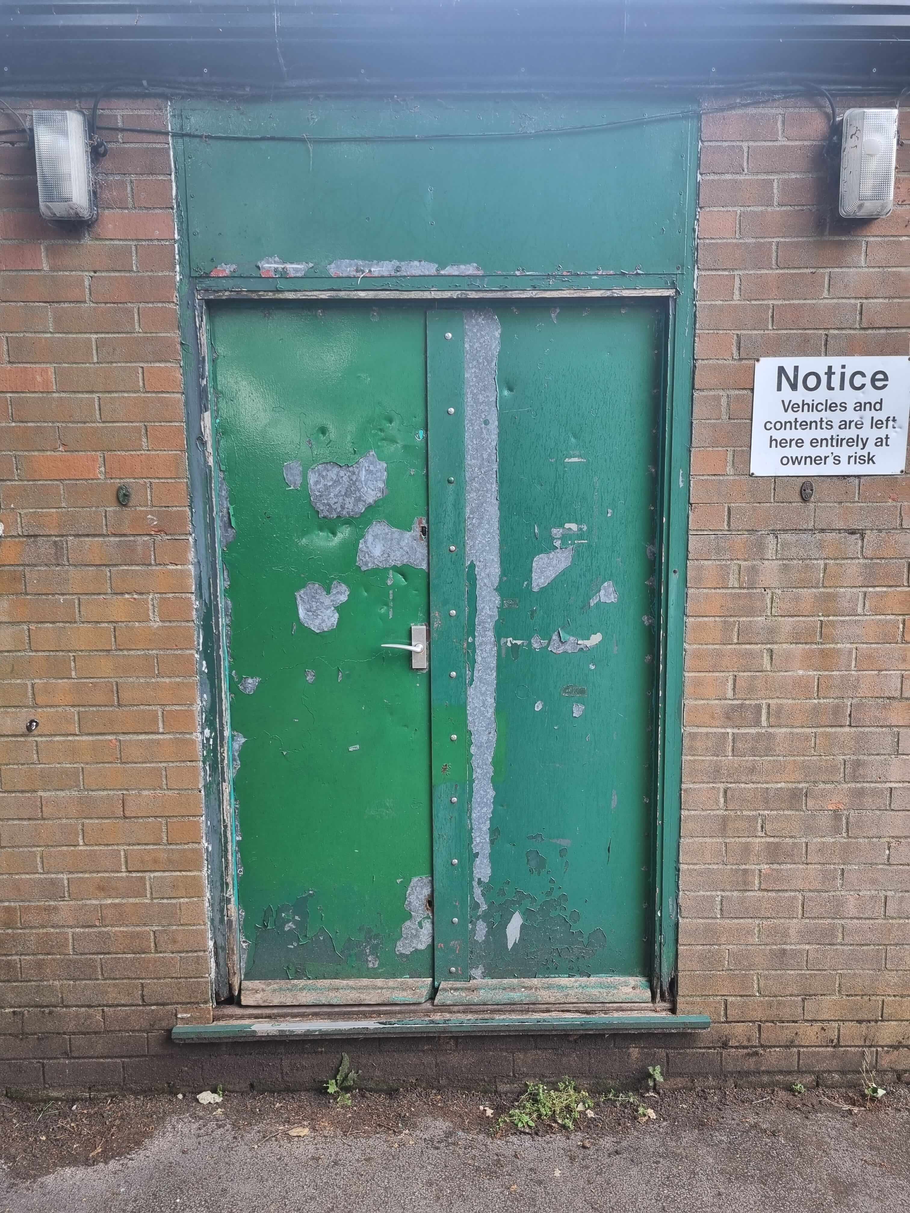 Old green metal double doors
