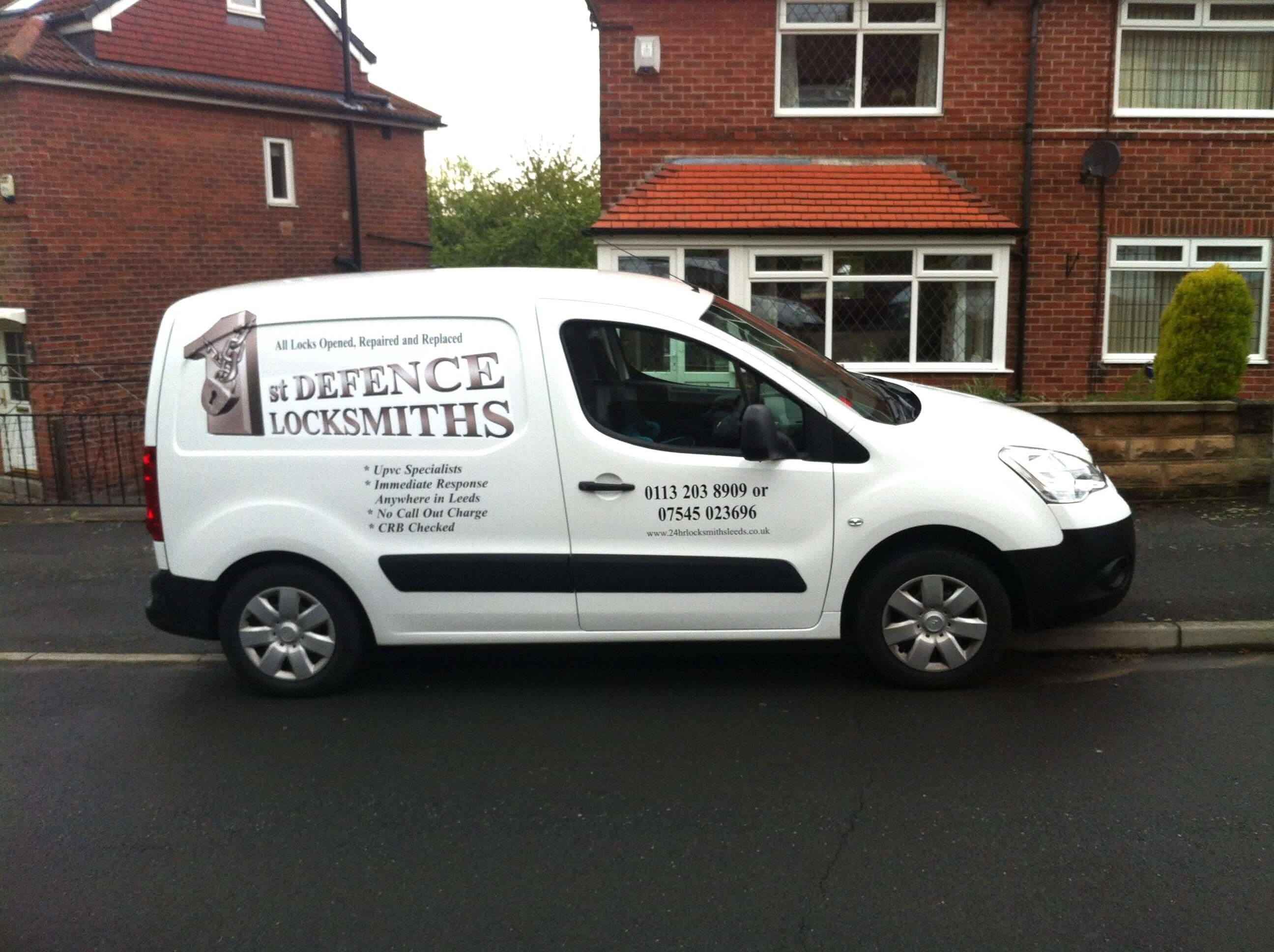 1st Defence Locksmiths Leeds Van parked on street showing signage and company logo